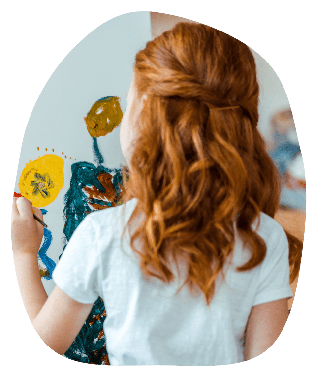 Child painting in an art therapy session